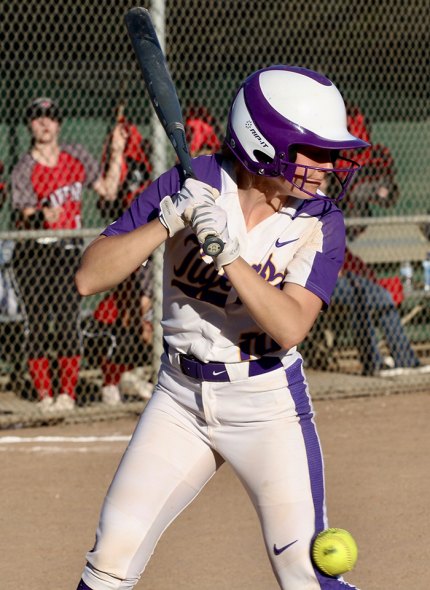 Lemoore's Megan Van Allen gets hit in the knee during the sixth inning of Friday's game against Hanford. The Bullpups won the game 5-0.